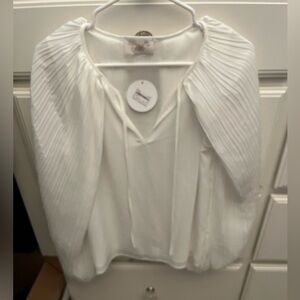 White cape sleeve blouse, size small. Runs big